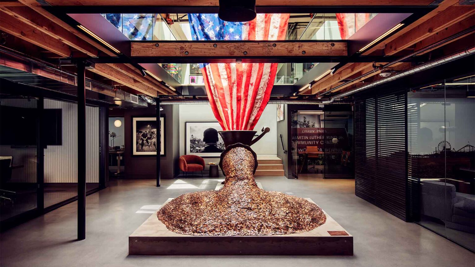 Second-floor art moment with curated installation and exposed structure.