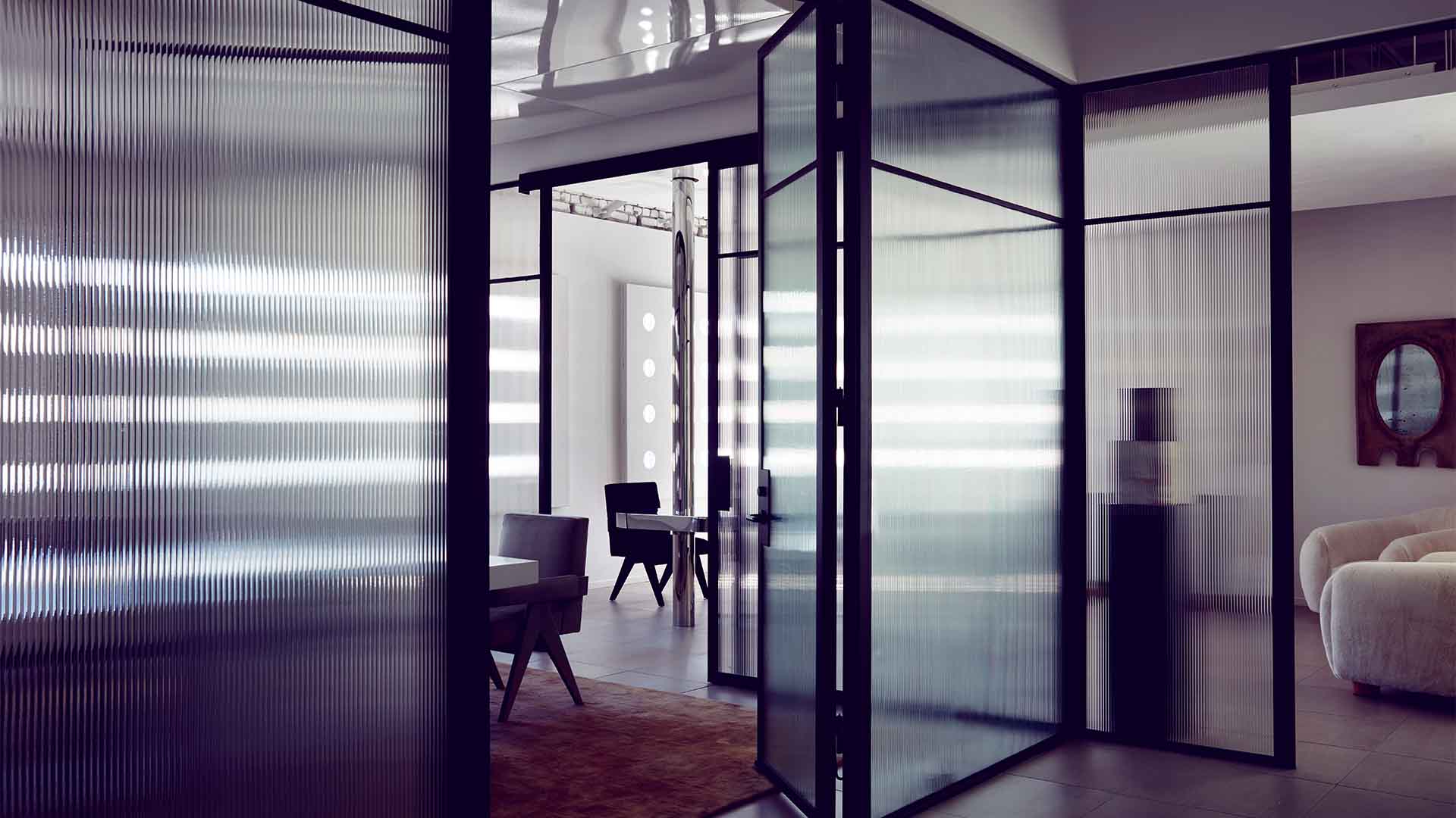 Refined workspace with fluted glass and filtered light.